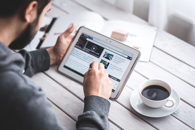 Man read tablet coffee